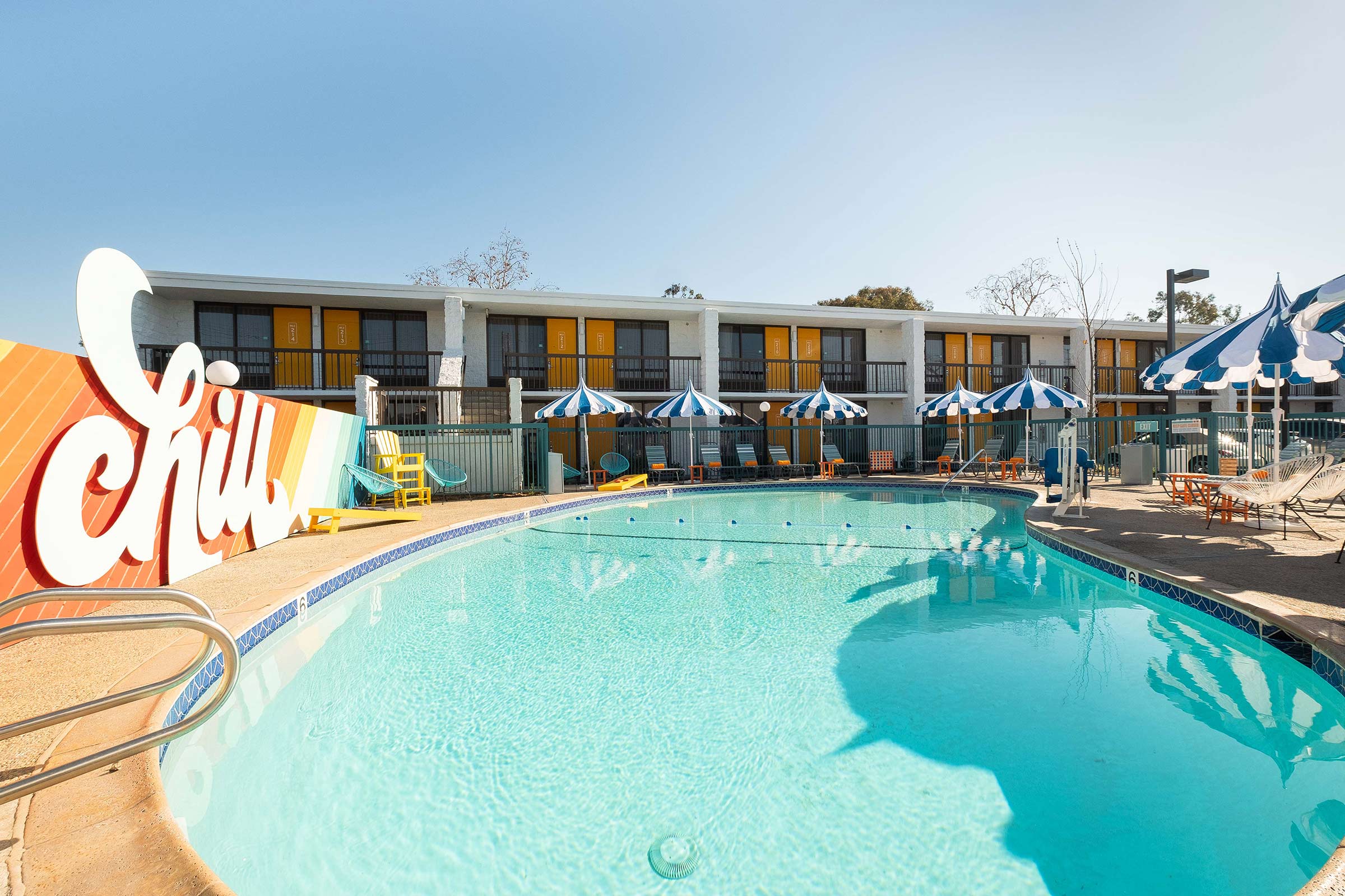 The Rambler Motel pool area with the iconic CHILL sign